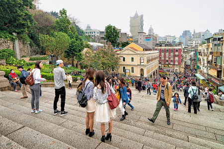 Macao, China - March 8, 2016: Tourists at the stairs of Santo Antonio in Historical old city center in Macao, China. People on the backgroundのeditorial素材
