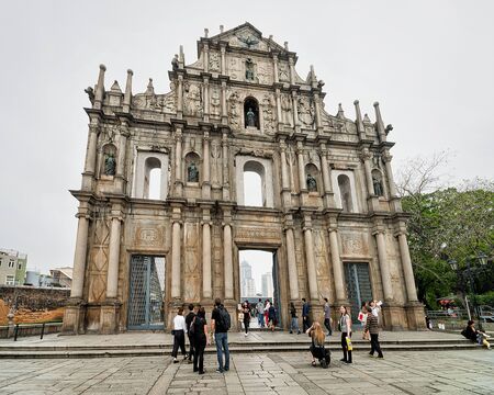 Macao, China - March 8, 2016: People at Ruins of Saint Paul Church in Historical old city center in...