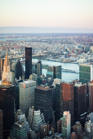 New York, USA - April 25, 2015: Aerial view from Observatory deck on Midtown district in Manhattan in New York, NYC. East river and New York Queensboro Bridge in Long Island City are on the backgroundのeditorial素材
