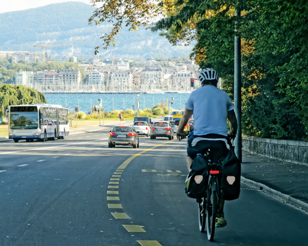 Man on bicycle on the road in Geneva, Switzerland.の写真素材