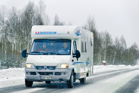 Rovaniemi, Finland - March 1, 2017: Caravan on road in  Rovaniemi, in winter Lapland, Finlandのeditorial素材