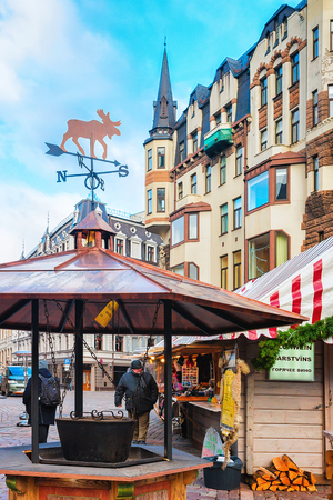 Riga, Latvia - December 28, 2016: Wood boiler on Christmas Market at Dome Square in Riga Old Town in winterのeditorial素材