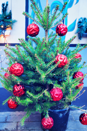 Christmas tree with red balls on Christmas Market in Riga Old Town in winterの写真素材