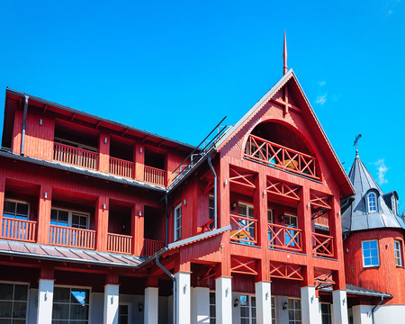 Druskininkai, Lithuania - May 1, 2017: Modern wooden red country house in Druskininkai, Lithuaniaのeditorial素材