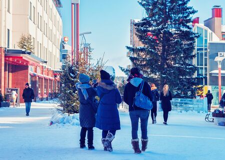 Rovaniemi, Finland - March 4, 2017: People passing by Lordi Square, winter Rovaniemi, Lapland, Finland.のeditorial素材