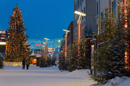Rovaniemi, Finland - March 1, 2017: People on Lordi Square in winter Rovaniemi, Lapland, Finland, at night.のeditorial素材