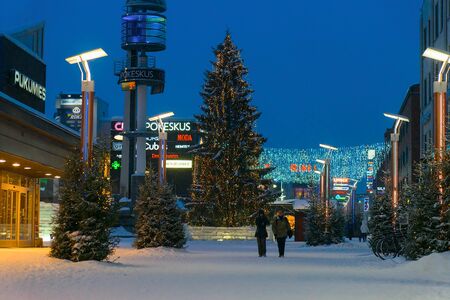 Rovaniemi, Finland - March 1, 2017: People in Lordi Square in winter Rovaniemi, Lapland, Finland, at night.のeditorial素材
