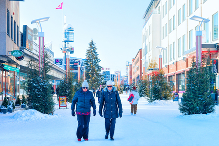 Rovaniemi, Finland - March 4, 2017: Senior people passing by Lordi Square in winter Rovaniemi, Lapland, Finland.のeditorial素材