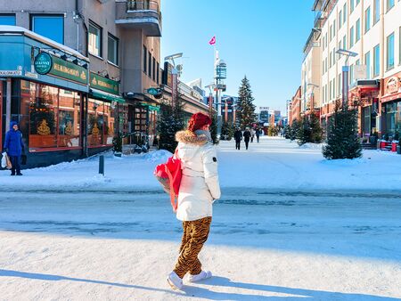 Rovaniemi, Finland - March 4, 2017: Woman passing by Lordi Square in Rovaniemi, Lapland, Finland, in winterのeditorial素材