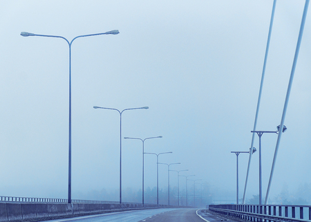 Electric pole at the snowy road in winter Rovaniemi, Lapland, Finlandの写真素材