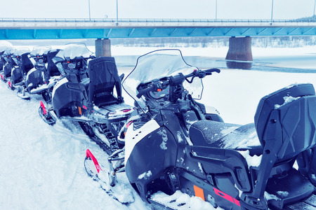 Snowmobiles on the frozen lake at winter Rovaniemi, Lapland, Finlandの写真素材