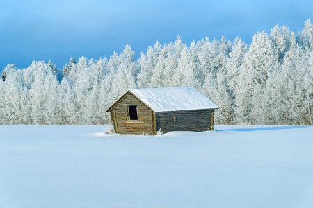 Wooden shed in winter countryside in Lapland, Finlandのeditorial素材
