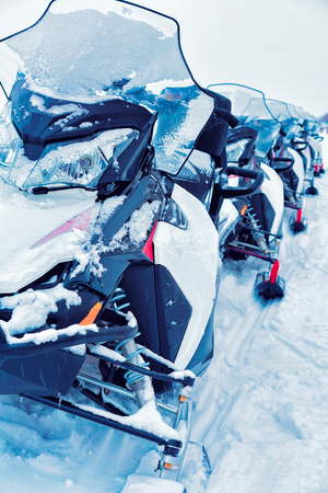 Snow mobiles in the frozen lake at winter Rovaniemi, Lapland, Finlandの写真素材