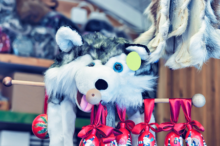 Market stall with traditional souvenirs such as husky dog toy in winter Rovaniemi, Lapland, Finland.の写真素材