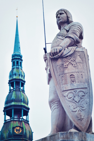 Roland Statue and Clock tower of St Peter Church in Riga Old Townの写真素材