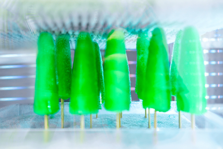 Selection of green frozen fruit sorbet icecream at the fridge on display at the cafe in Positano town, Amalfi coast, Italyの写真素材