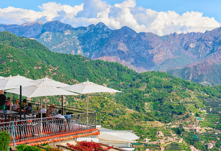 Ravello, Italy - October 2, 2017: Open air street restaurant with umbrellas, Ravello village, Tyrrhenian sea, Amalfi coast, Italyのeditorial素材