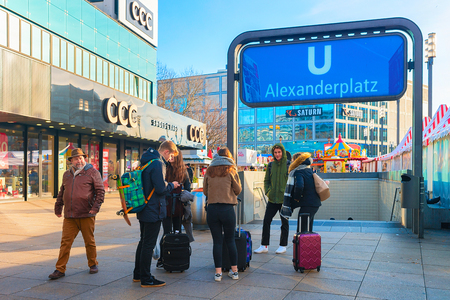 Berlin, Germany - December 10, 2017: Young tourists at the entrance into Alexanderplatz station in Berlin, Germanyのeditorial素材