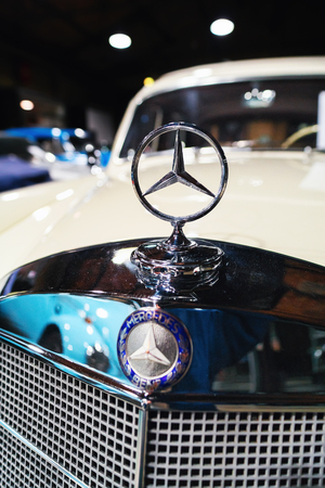 Berlin, Germany - December 11, 2017: Emblem and radiator grill of white Retro Mercedes Benz Ponton car in the garage in Berlin, Germanyのeditorial素材