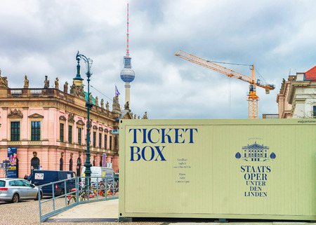 Berlin, Germany - December 12, 2017: Advertising og Ticket box of Berlin State Opera and Television tower on the background in Berlin, Germanyのeditorial素材