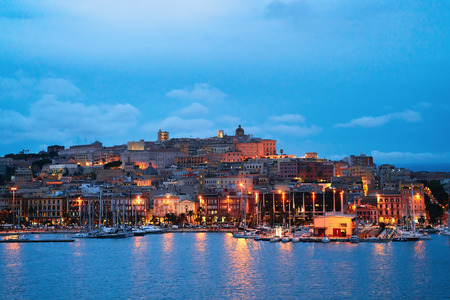 Cityscape with marina in the Mediterranian sea in the evening in Cagliari, Sardinia, Italyの写真素材