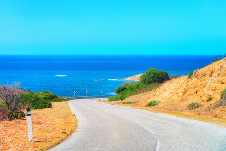 Road along the Mediterranean sea at Buggerru, Carbonia-Iglesias, Sardinia, Italyの写真素材