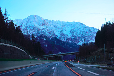 Road with a view on Alpine mountains in Austria at twilightの写真素材