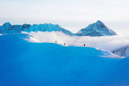 People at the top in Kasprowy Wierch in Zakopane in Tatras in winter. Zakopane is town in Poland in Tatra Mountains. Kasprowy Wierch is a mountain in Zakopane and the most popular ski area, Polandの写真素材