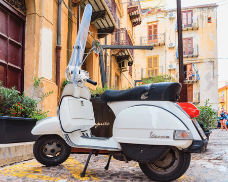 Cefalu, Italy - September 26, 2017: Scooter in street of Cefalu old town, Palermo region, Sicily island, in Italyのeditorial素材