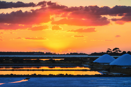 Sunset at salt evaporation pond at Marsala, Sicily island, Italyの写真素材