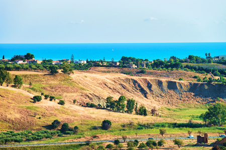 Landscape and Mediterranean Sea in the Valley of the Temples in Agrigento, Sicily, Italyの写真素材