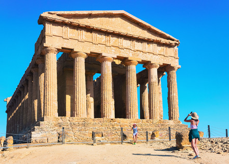 Agrigento, Italy - September 22, 2017: Woman taking photos of Temple of Concordia at Agrigento in Sicily, Italyのeditorial素材
