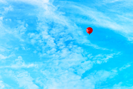 Vilnius, Lithuania - September 3, 2015: Red colorful air balloon fly in the sky, Vilnius, Lithuaniaのeditorial素材