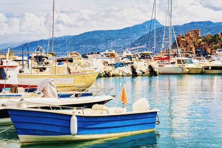 Boats at Cefalu port in the Mediterranean sea, Palermo region, Sicily island in Italyの写真素材