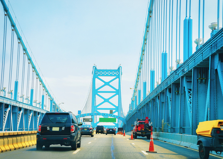Car on Benjamin Franklin Bridge in New Jersey, America. Focus in motionの写真素材