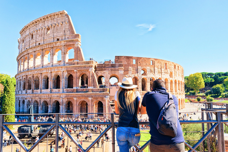 Young couple at Colosseum in the old city center of Rome, Italy. It is amphitheater in Rome.のeditorial素材