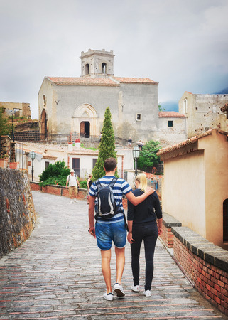 Savoca, Italy - September 27, 2017: Young couple at the Church of San Michele in Savoca village, Sicily, Italyのeditorial素材