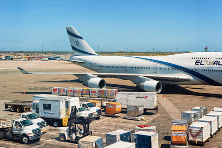 New York, USA - May 7, 2015: Israel Airlines Airplane wing with luggage and cargo at JFK...