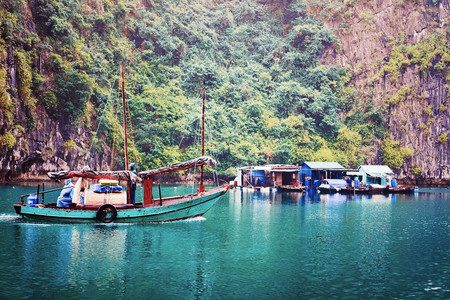 Halong, Vietnam - February 23, 2016: Boat at floating fishing village of Ha Long Bay, Vietnamのeditorial素材