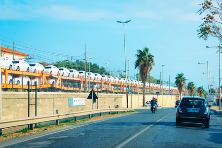 Rome, Italy - September 7, 2017: New car carrier train and the road. Truck transporterのeditorial素材