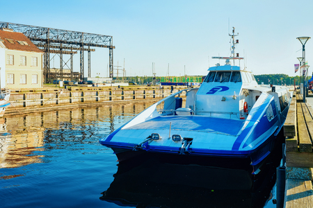 Klaipeda, Lithuania - May 9, 2016: Catamaran at embankment of Dane River in Old town of Klaipeda in Lithuania, Eastern European country on the Baltic seaのeditorial素材