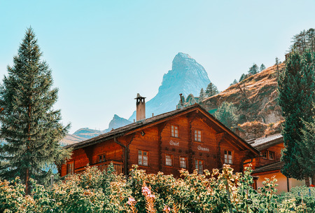 Zermatt, Switzerland - 24 August, 2016: Traditional Swiss Chalet in Zermatt with Matterhorn summit, Switzerland in summer.のeditorial素材