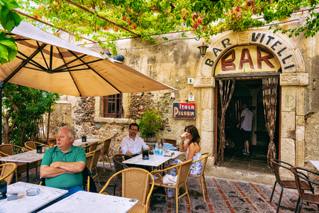 Savoca, Italy - September 27, 2017: Vitelli bar with tourists in Savoca, Sicily island, Italy. It is a place from the film Godfather.のeditorial素材