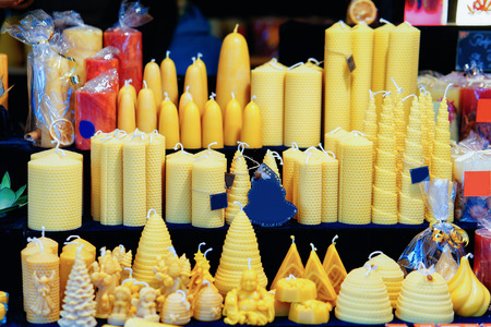 Stall with candles at Night Christmas Market at Town Hall in Winter Berlin, Germany. Advent Fair Decoration and Stalls with Crafts Items on the Bazaar.の写真素材