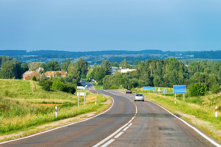 Scenery with car on the road in Polandの写真素材