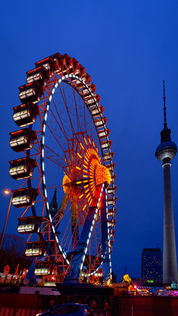 Ferris Wheel with Fernsehturm at Night Christmas Market at Town Hall in Winter Berlin, Germany.のeditorial素材