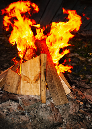 Wood burning in the fireplace in Siberia in Russiaの写真素材
