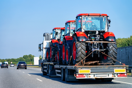 Tractor carrier truck on the asphalt road in Slovenia. Truck transporterの写真素材