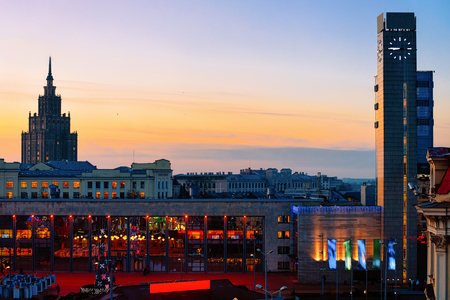 Romantic view on Railway station tower and Stalinist skyscraper of Academy of Sciences in Riga in Latvia at night.の写真素材