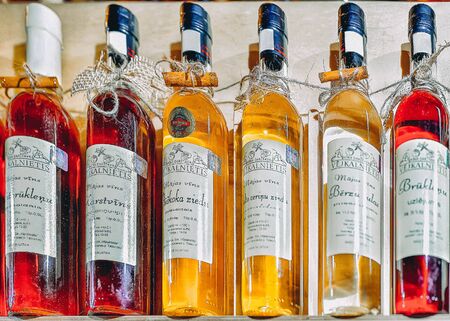 Riga, Latvia - December 26, 2015: Bottles of wine at Christmas market in Riga in Latvia in winter.のeditorial素材